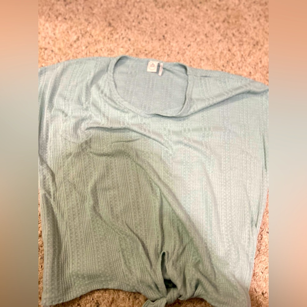 Teal colored shirt size (L)